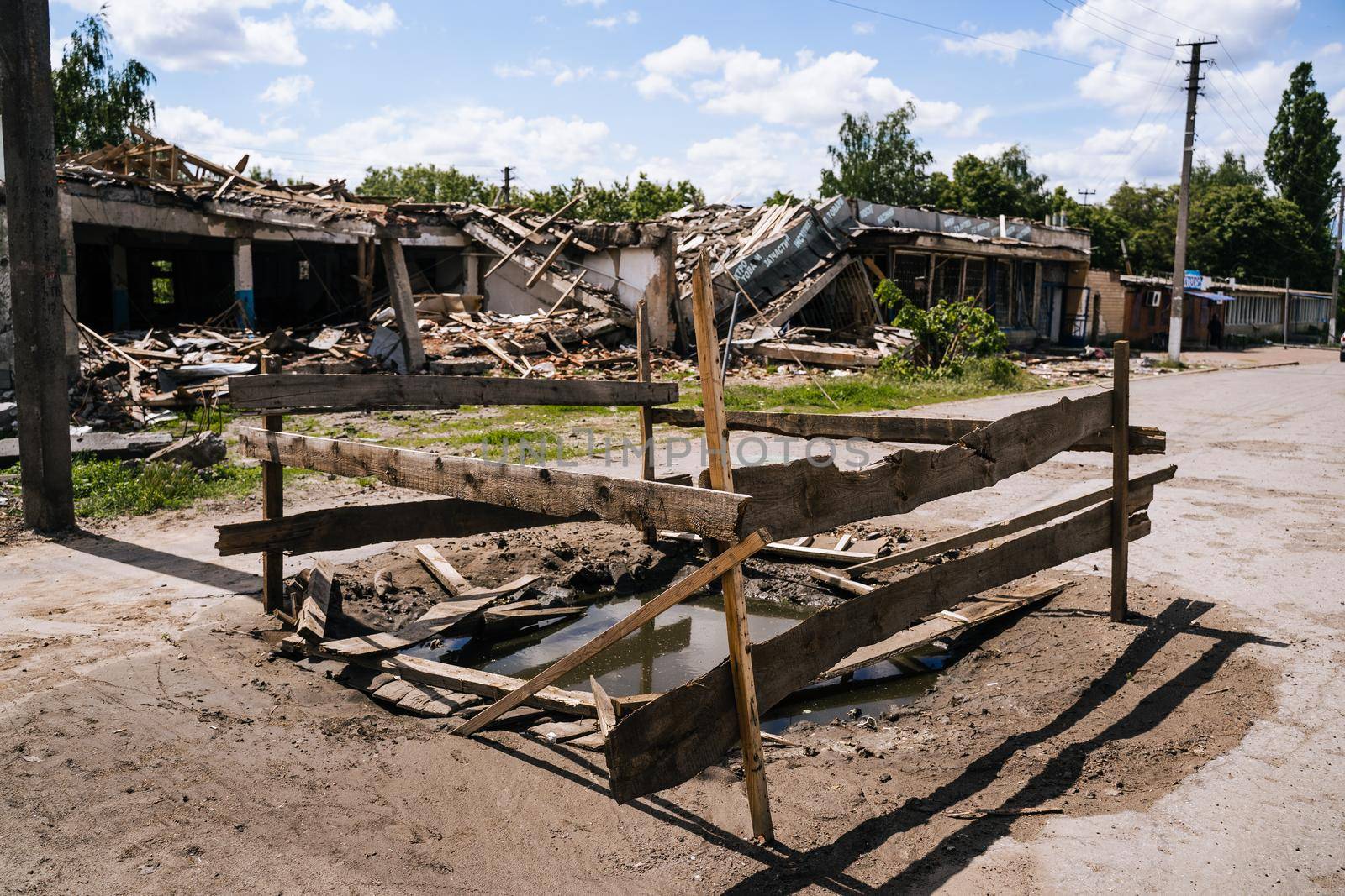 War in Ukraine. Crater from an explosion in the Sumy region. Russia's military invasion of Ukraine