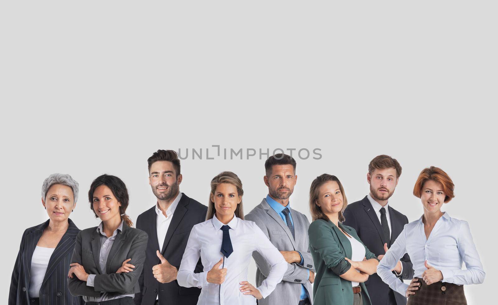 Group happy colleagues a business team isolated on gray background with copy space for text content