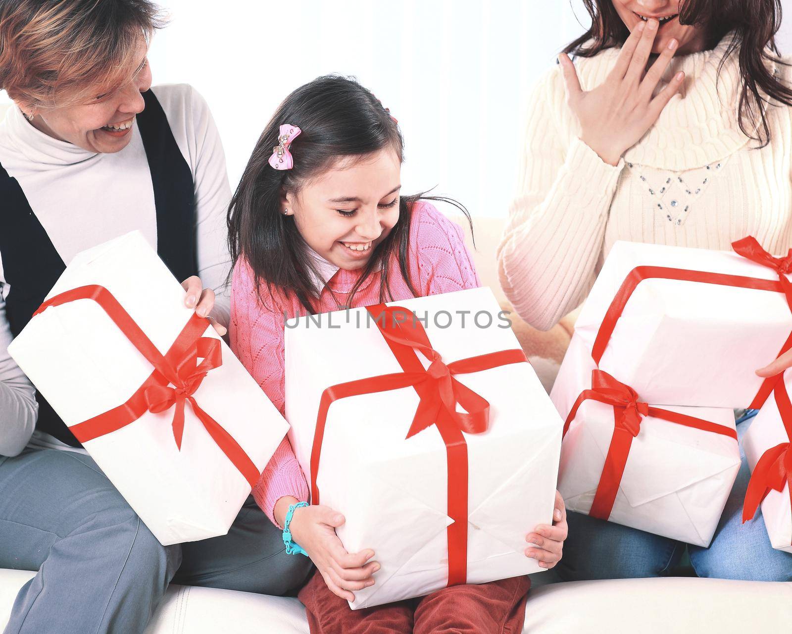 Sweet girl shares with the family with holiday gifts