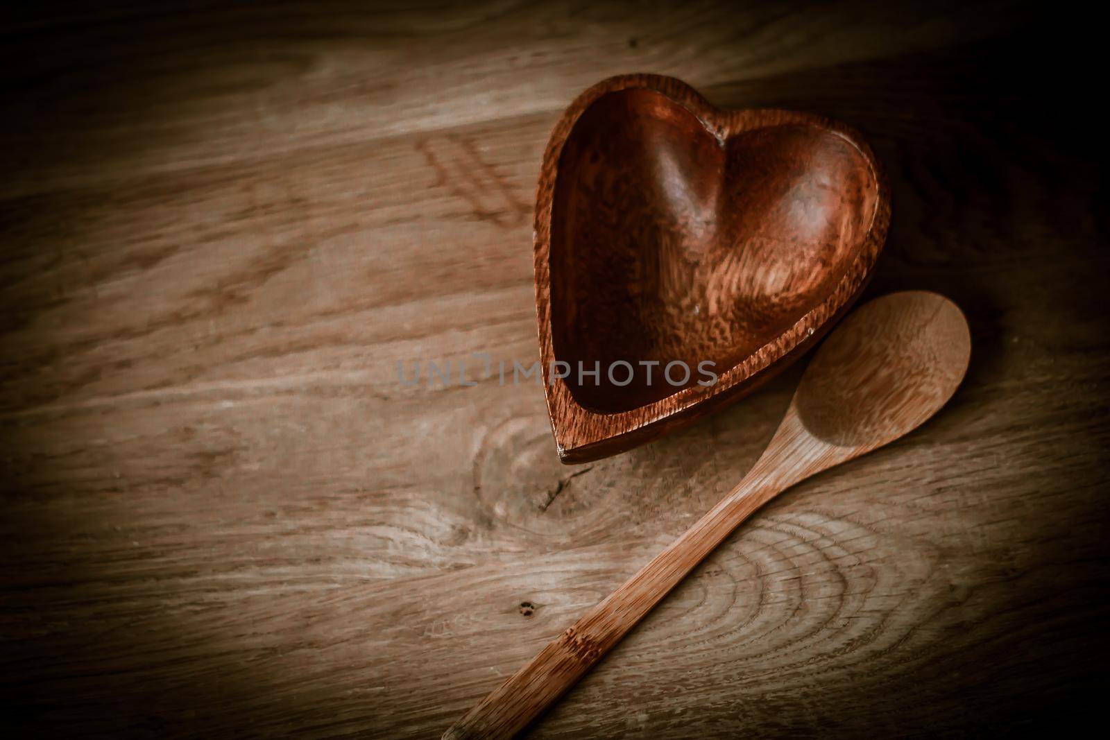 closeup. empty wooden salad bowl and wooden paddle on a wooden table