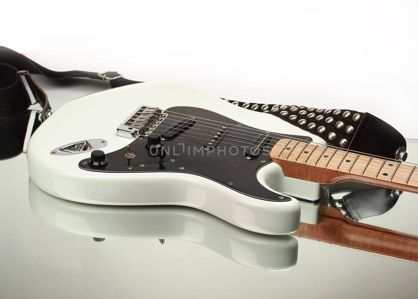 closeup.electric guitar with strap isolated on white background.photo with copy space