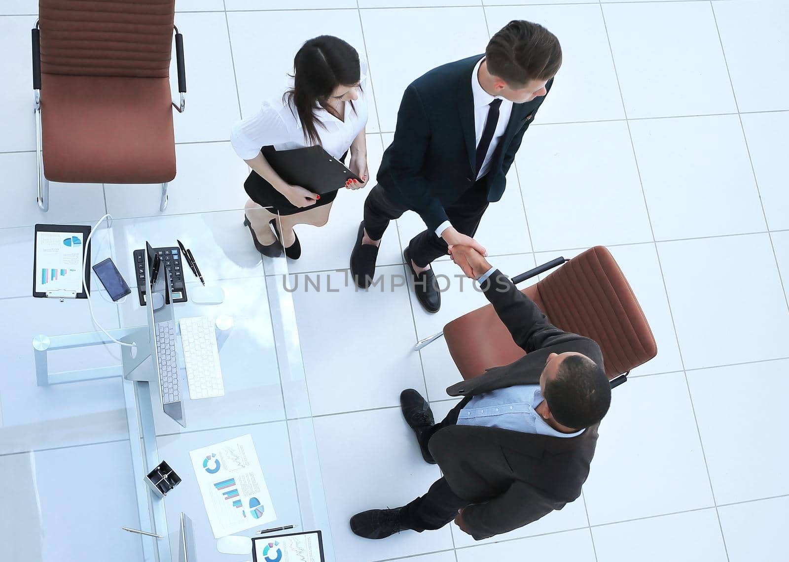view from the top.the handshake business partners at a business meeting . the concept of cooperation.