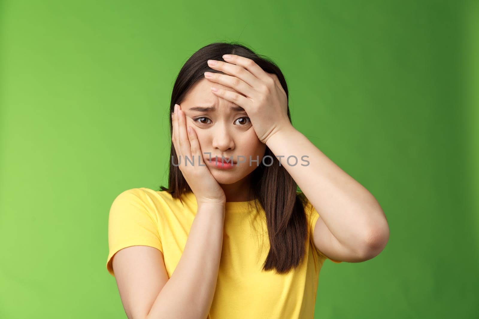 Close-up perplexed devastated distressed cute young teenage girl worrying passing exam grab head, facepalm, frowning grimacing upset, sulking terrible situation feel stressed and depressed.