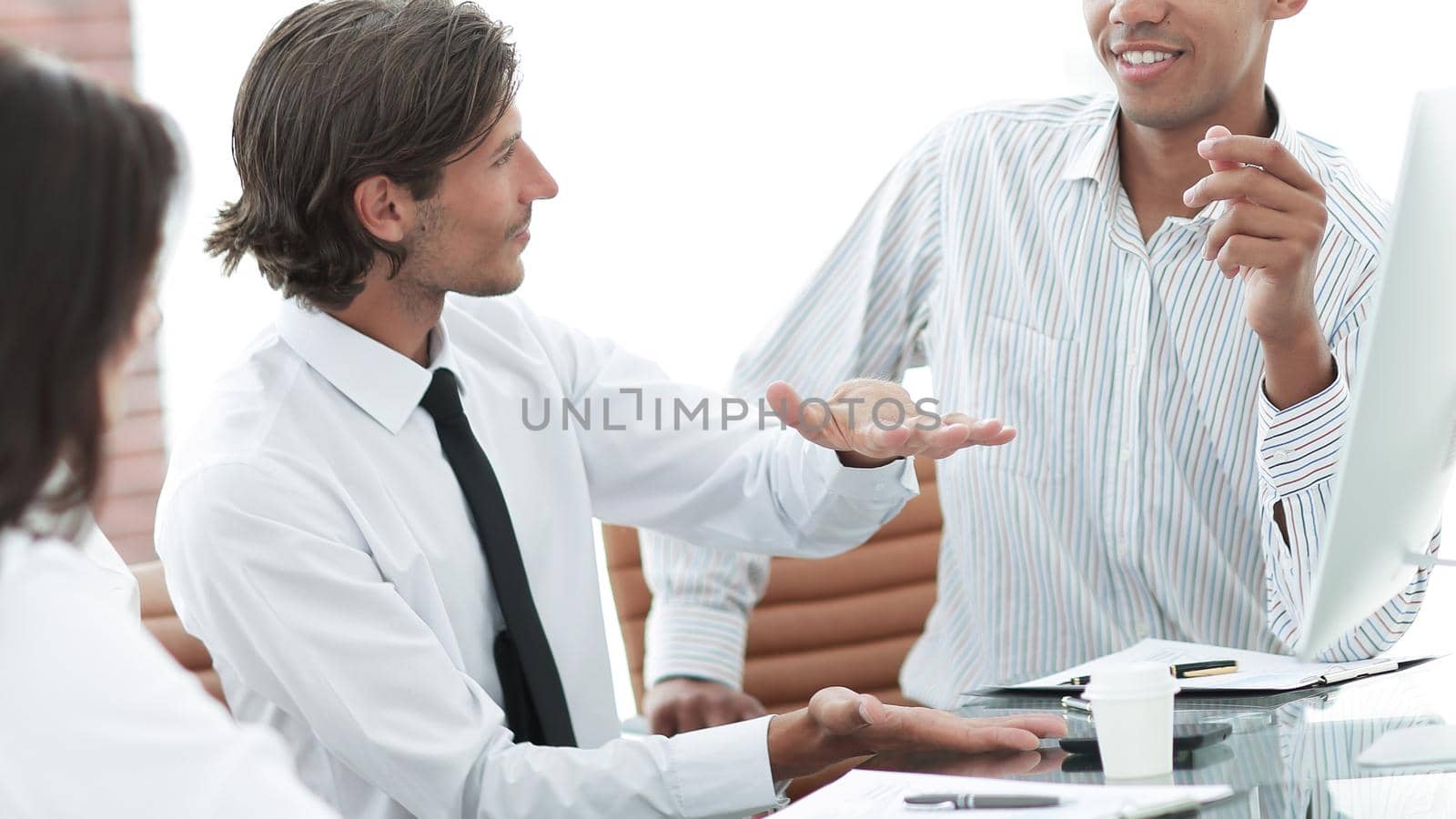 businessman talking to a business team sitting at Desk.photo with copy space