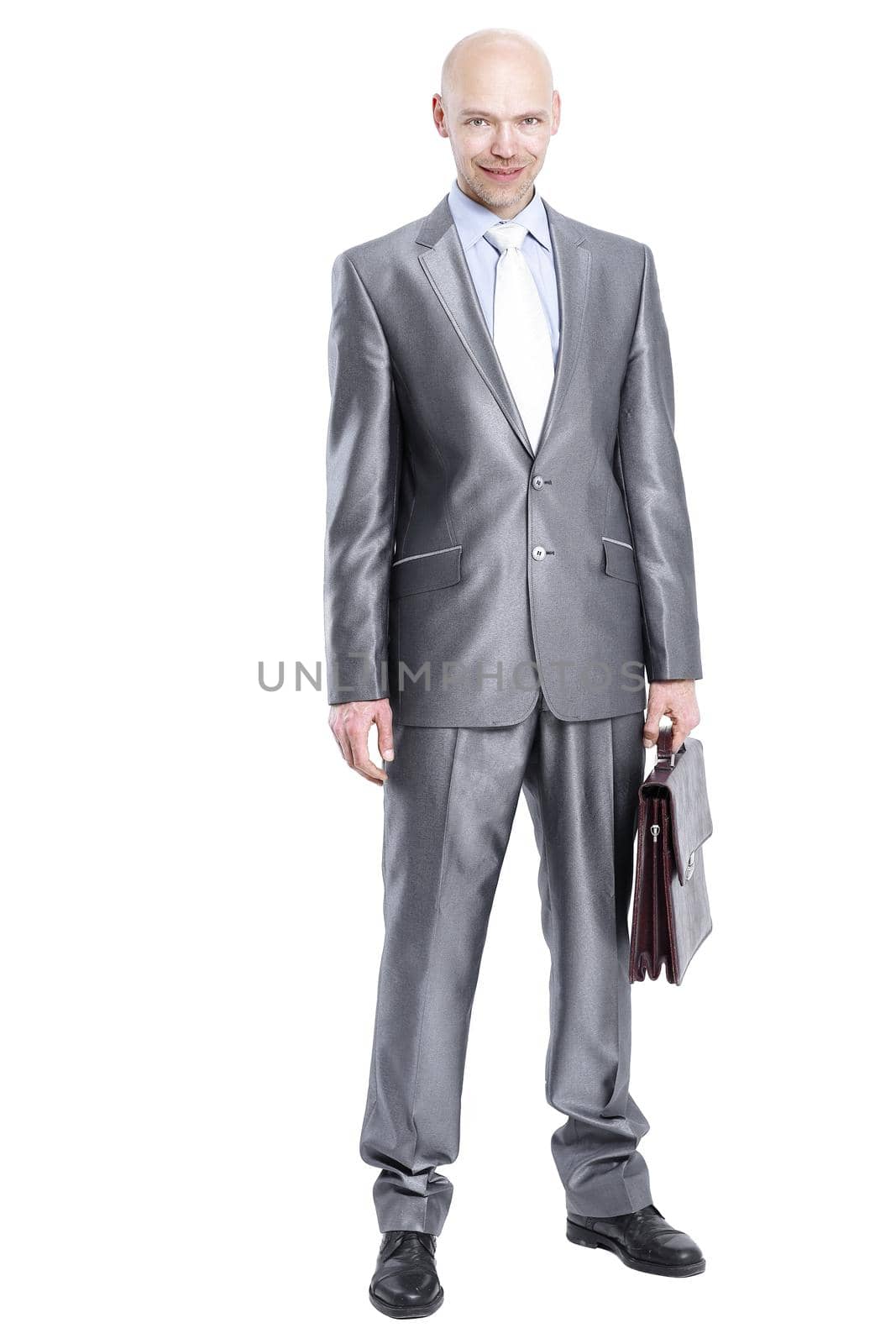handsome businessman with a leather briefcase.isolated on white.
