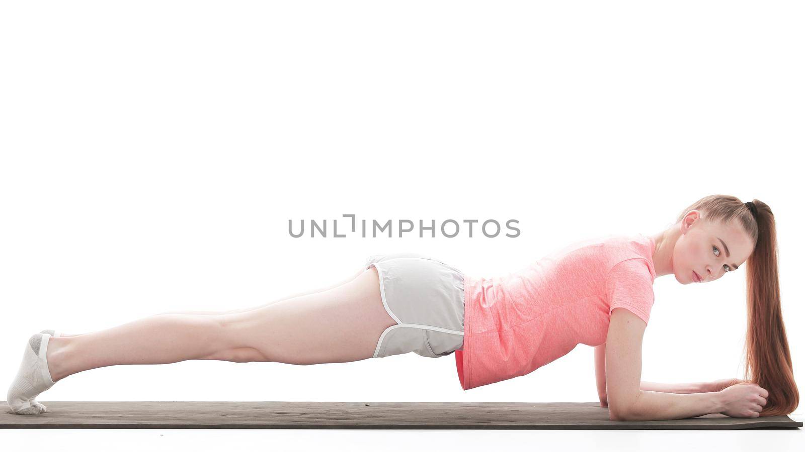 sports business woman performing exercise-plank.photo with copy space by SmartPhotoLab