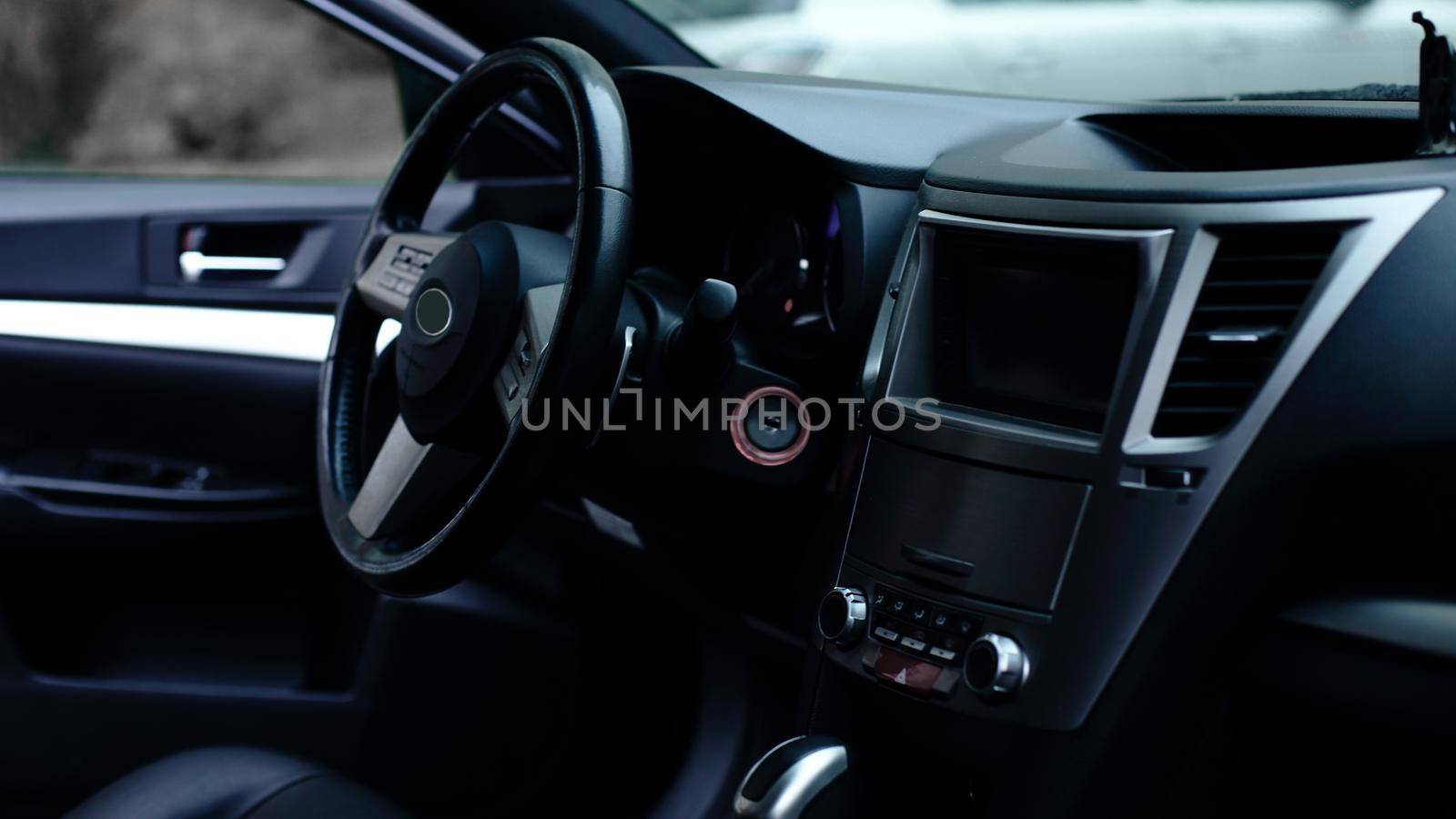 View of the interior of a modern automobile showing the dashboar by SmartPhotoLab