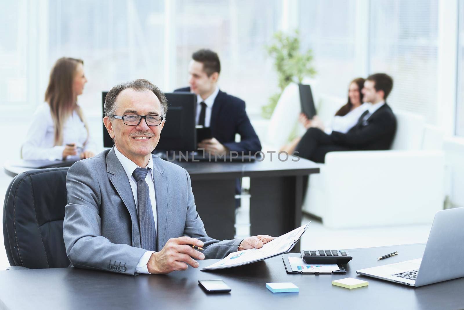 experienced businessman working with financial documents office.photo with copy space