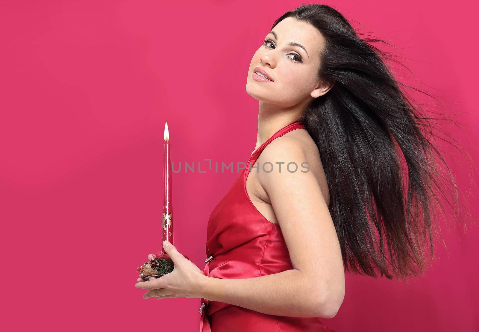 closeup . a young woman with a Christmas candle.photo with copy space
