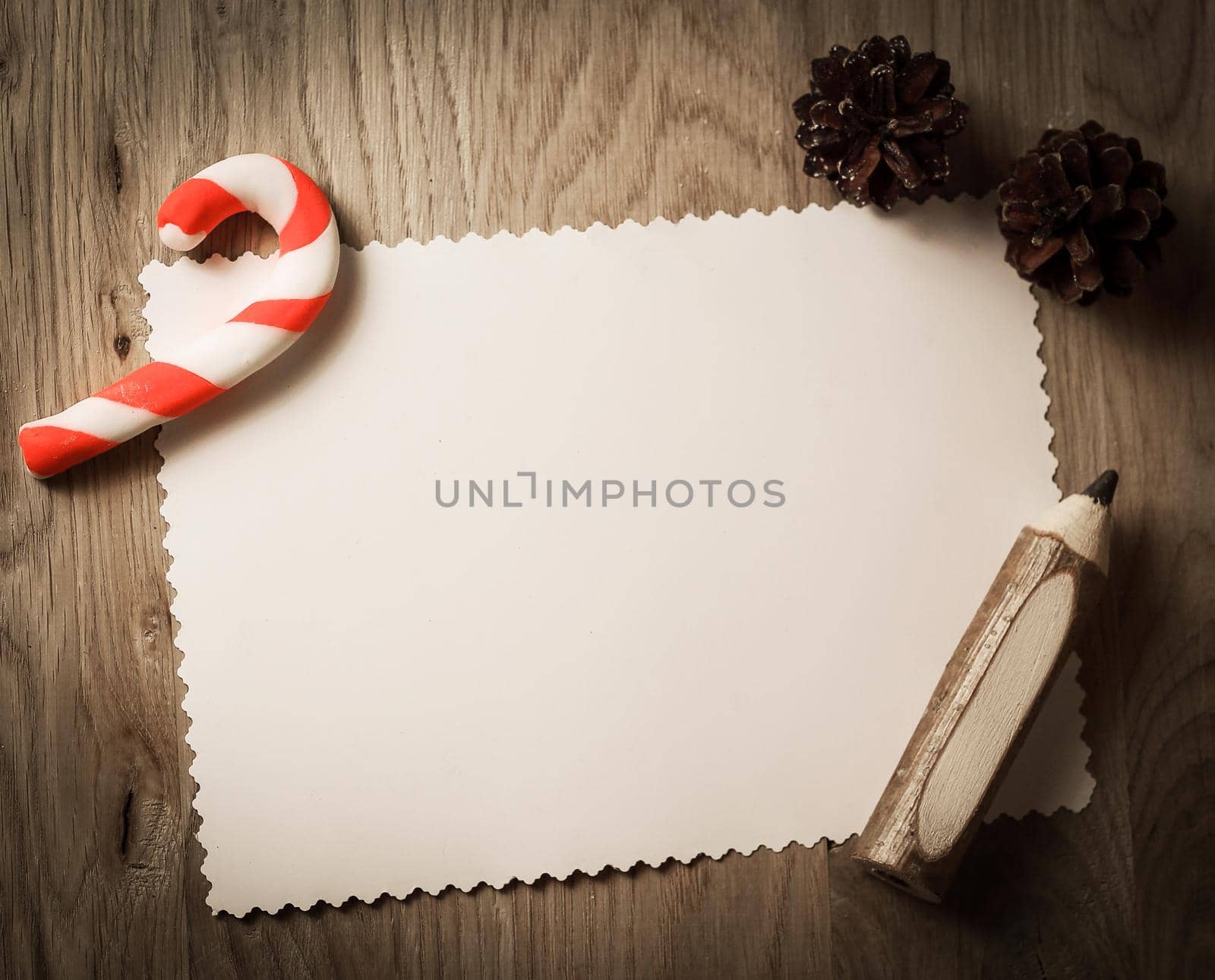 blank greeting card for Christmas and pencil on wooden backgroun by SmartPhotoLab