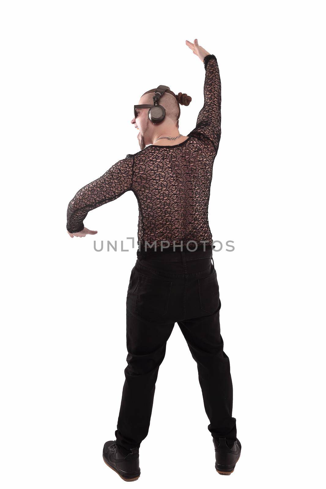 rear view .the guy rapper with a cool hair listens to music.isolated on white.photo with copy space
