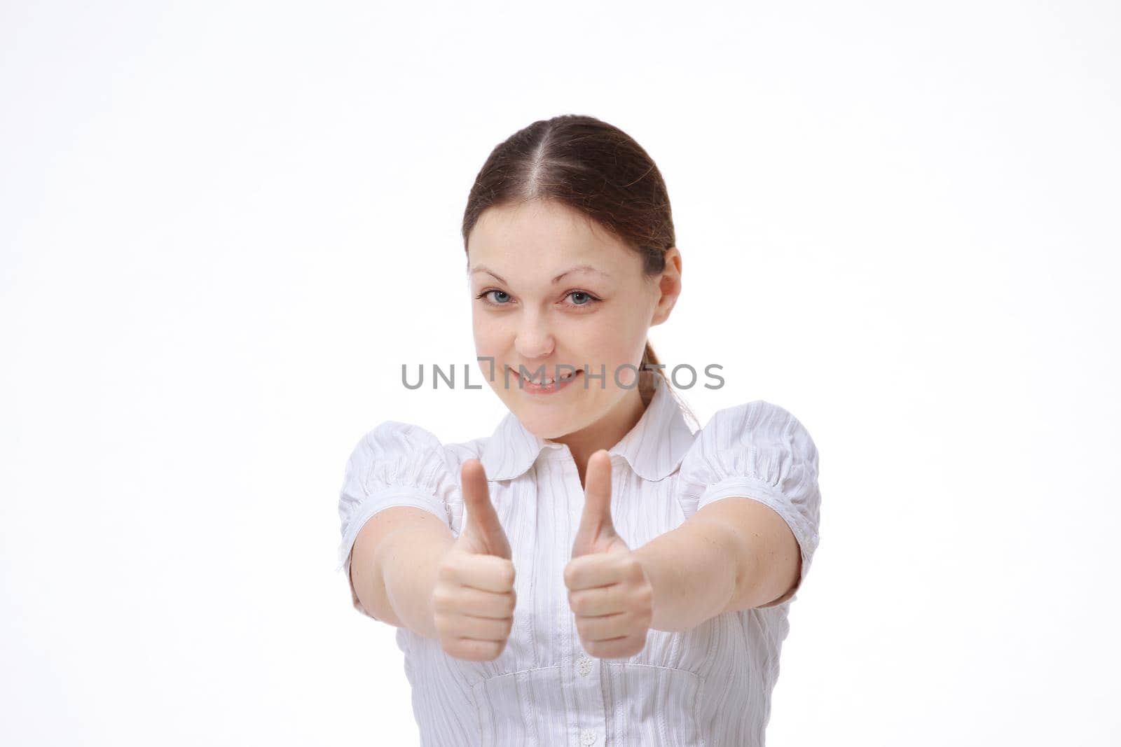 young woman employee showing showing thumbs up by SmartPhotoLab