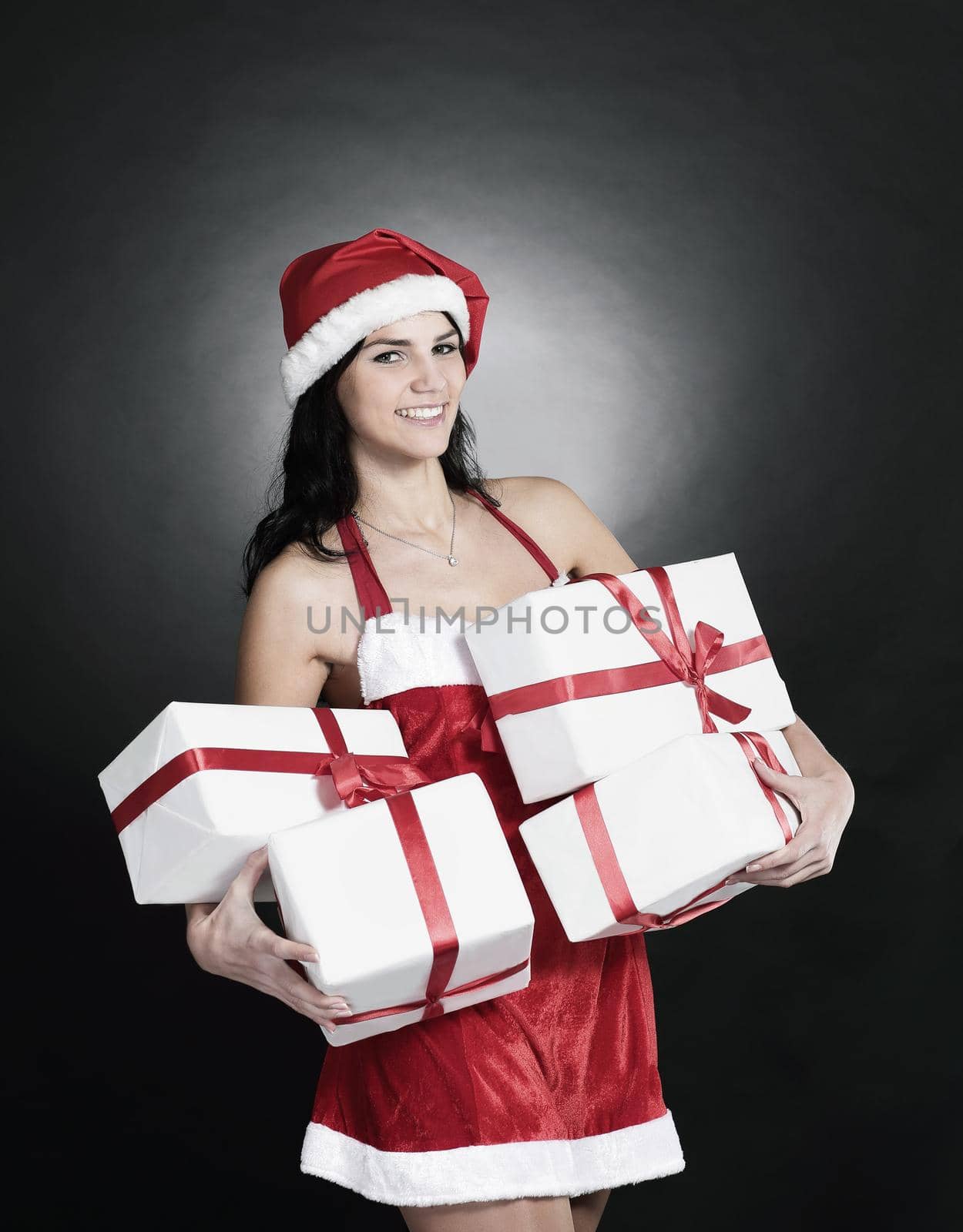 happy young woman in costume of Santa Claus with lots of Christ by SmartPhotoLab