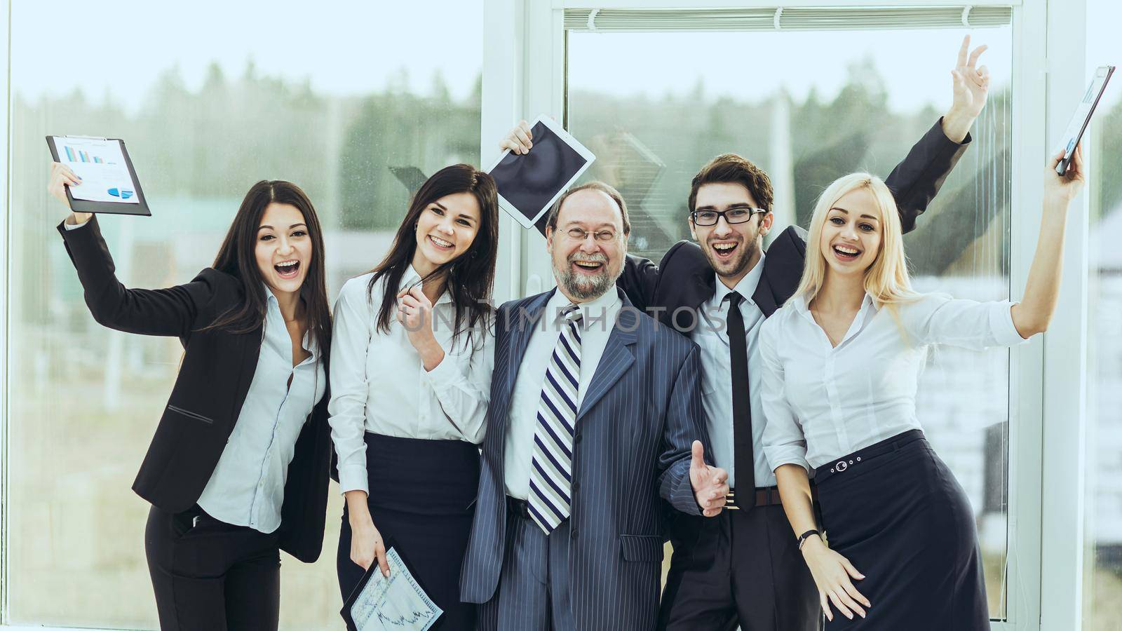 leader and successful business team cheering after signing a lucrative financial contract.