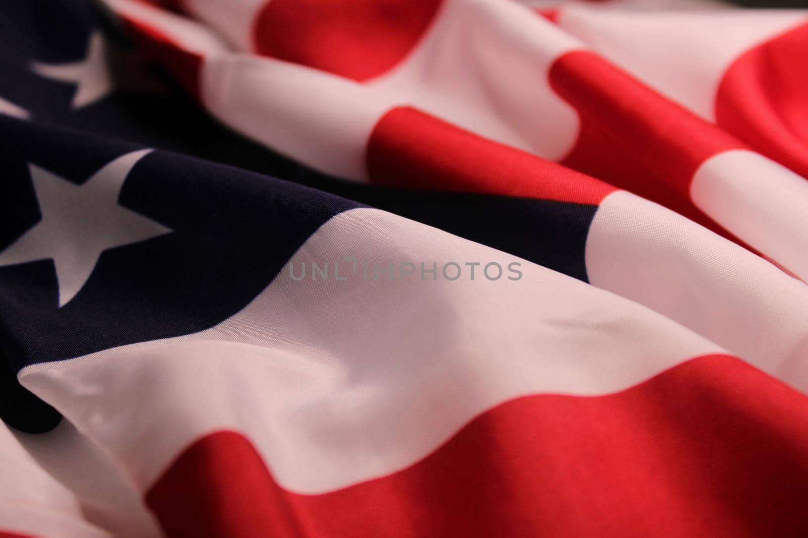 The flag of the United States, folded in waves. The concept of Independence Day, elections, Memorial Day..