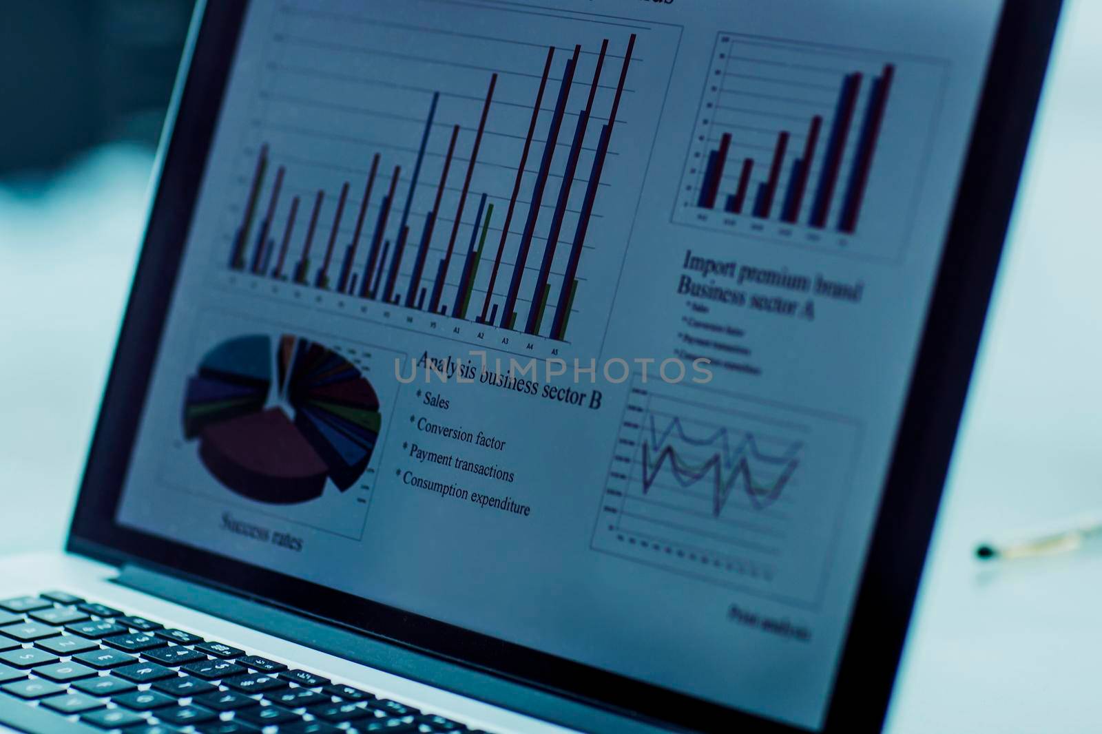 closeup of the laptop screen with financial chart on a workplace of the businessman