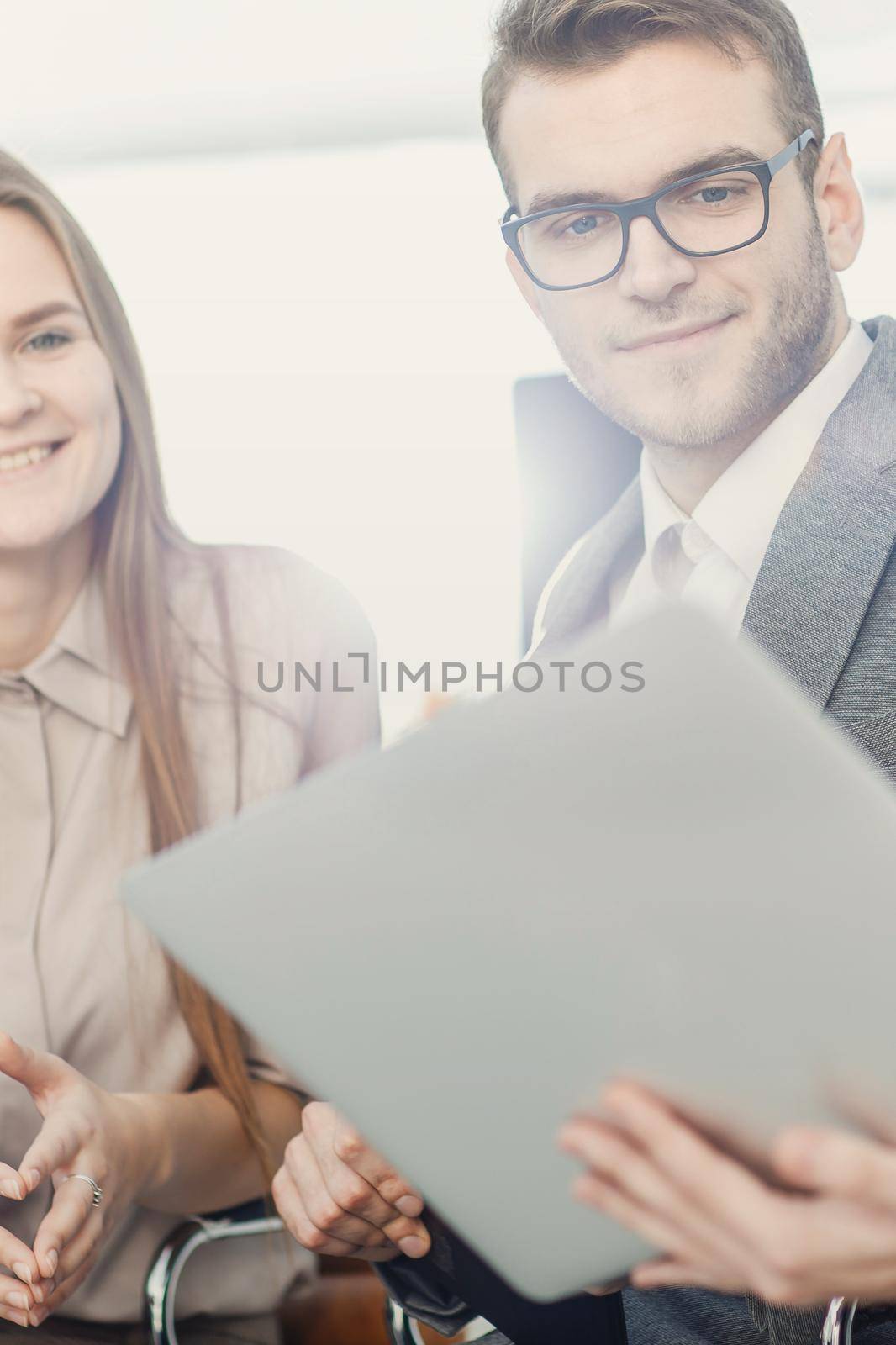 closeup of friendly business team working on laptop and discussing business matters.