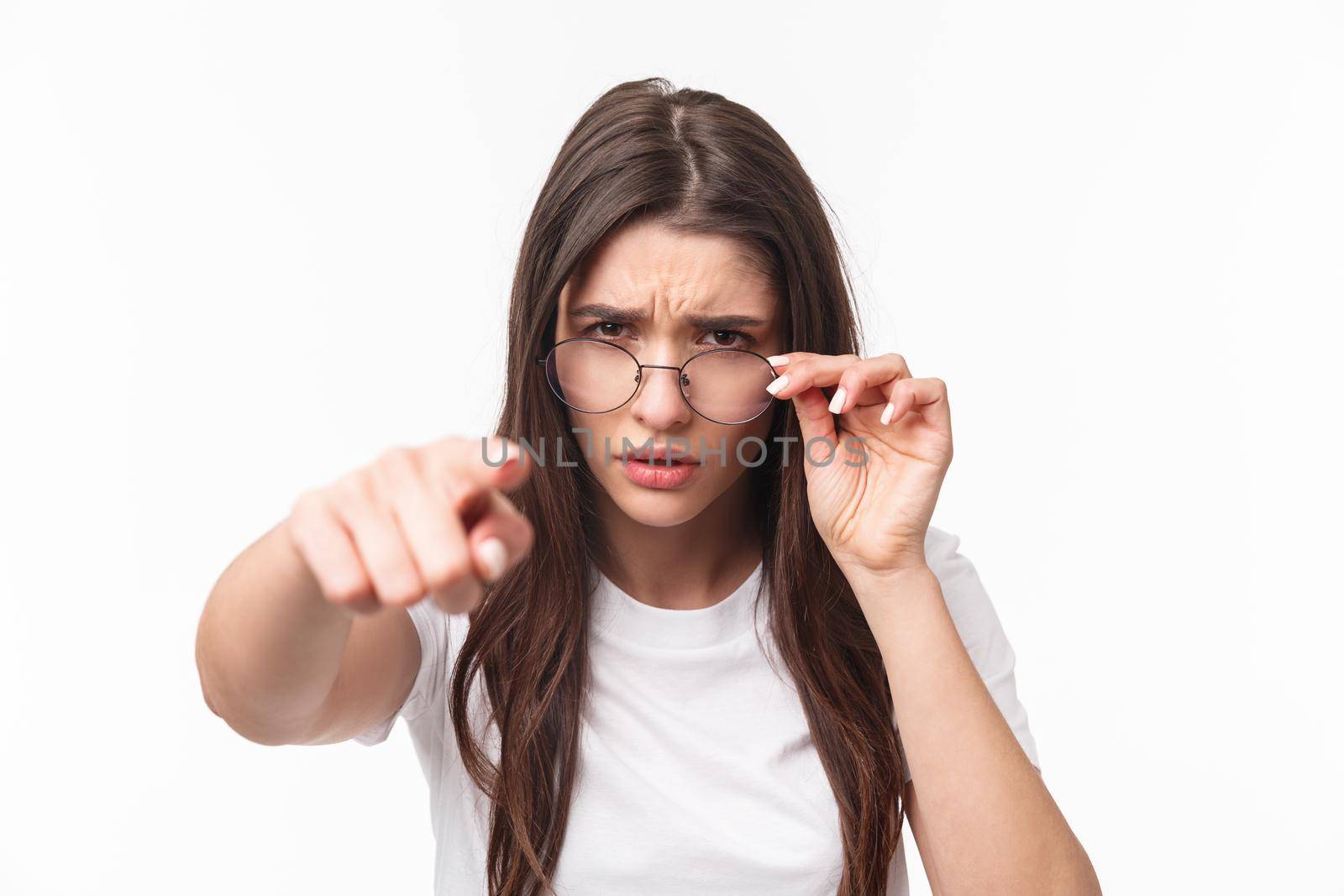 Close-up portrait of suspicious, judgemental woman in glasses, blame someone, frowning, squinting at person who she blames, pointing finger accuse for stealing her meal from office fridge by Benzoix