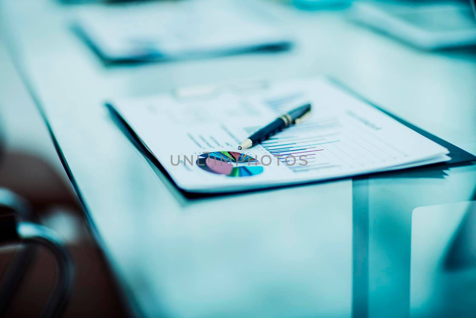 close-up of pen and financial documents on the table of the businessman. the photo is a blank space for your text