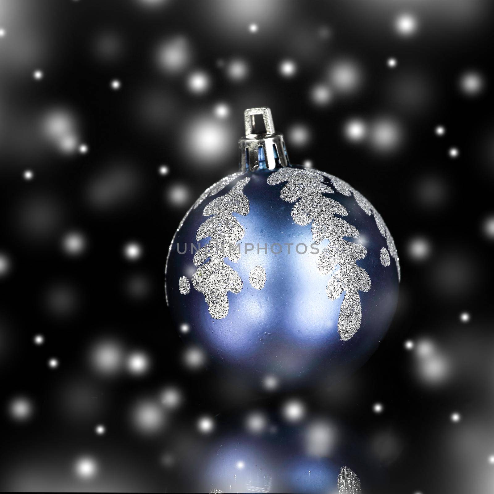 bright blue Christmas ball on a black background.photo with copy space