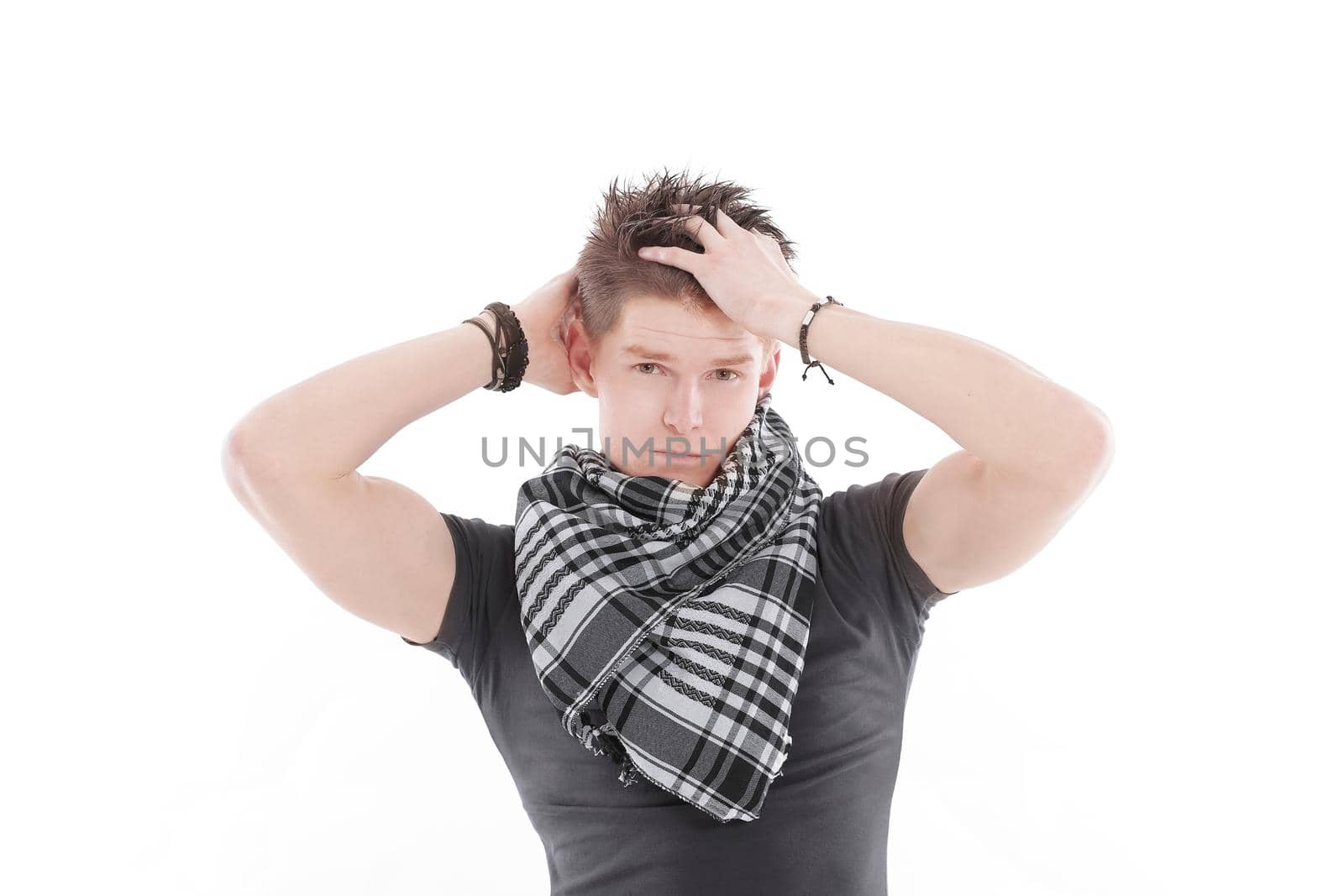 young man in a t-shirt and scarf.isolated on a white background.