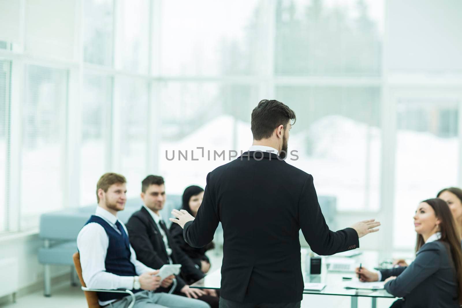 CEO speaks at the workshop business team in a modern office. the photo has a empty space for your text.