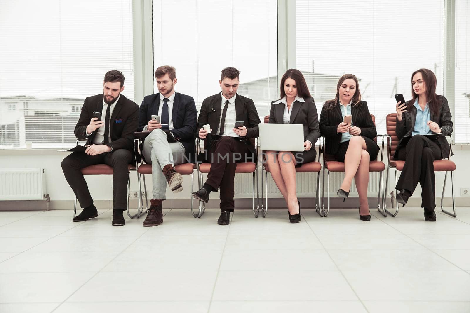 business team working with documents prior to the working session . the photo has a empty space for your text.