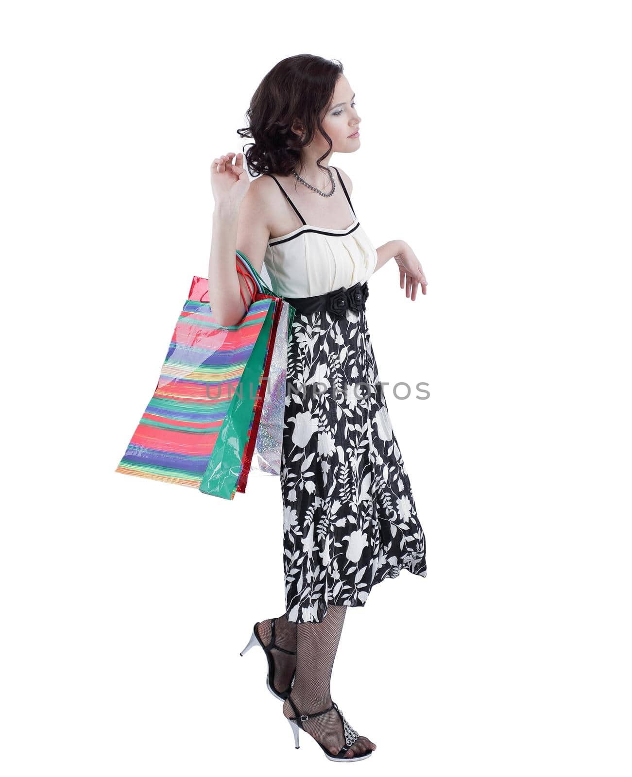 successful young woman with purchases going forward. by SmartPhotoLab