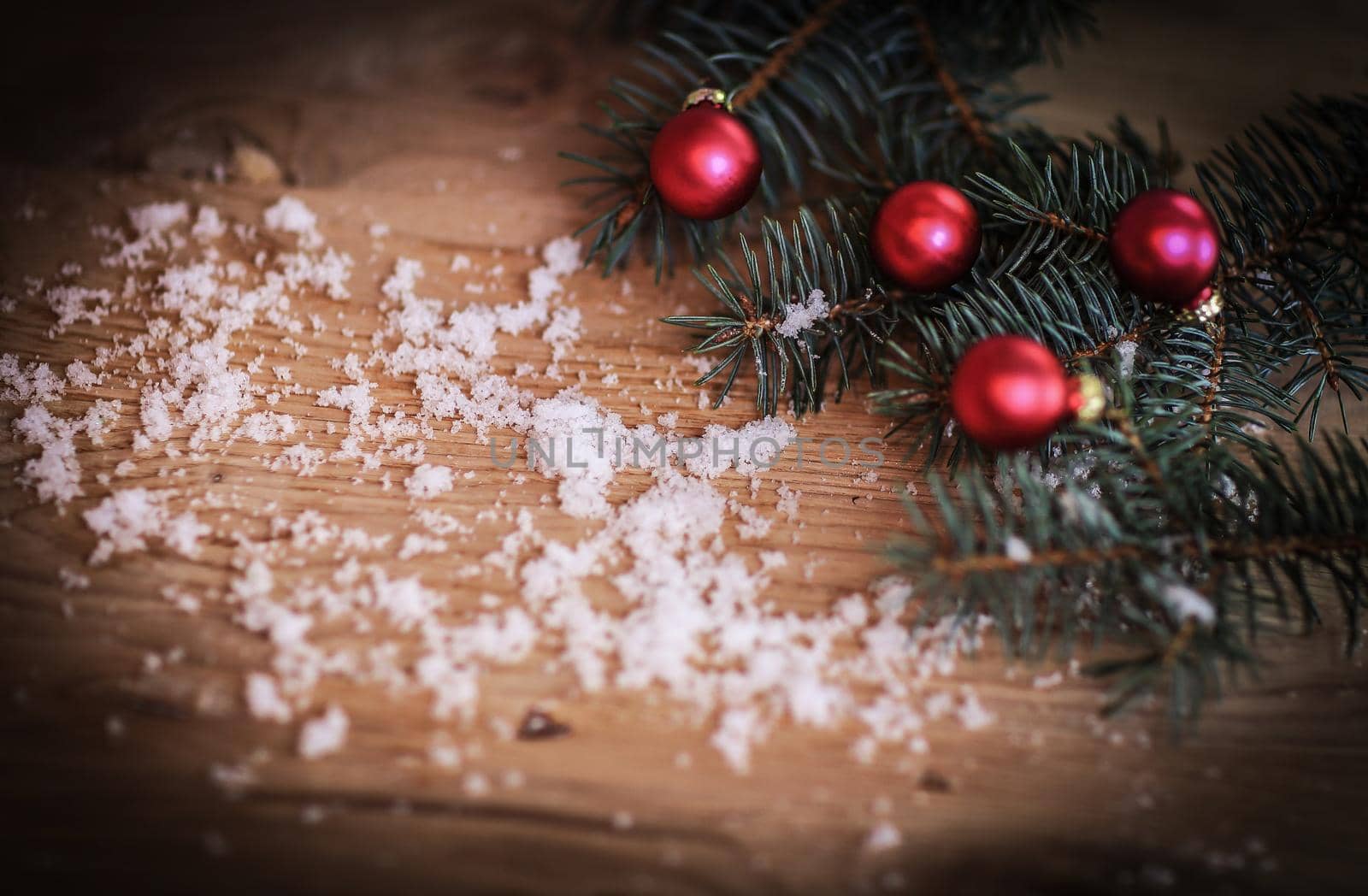 Christmas background.Christmas tree branch with balls on wooden background.photo with place for text