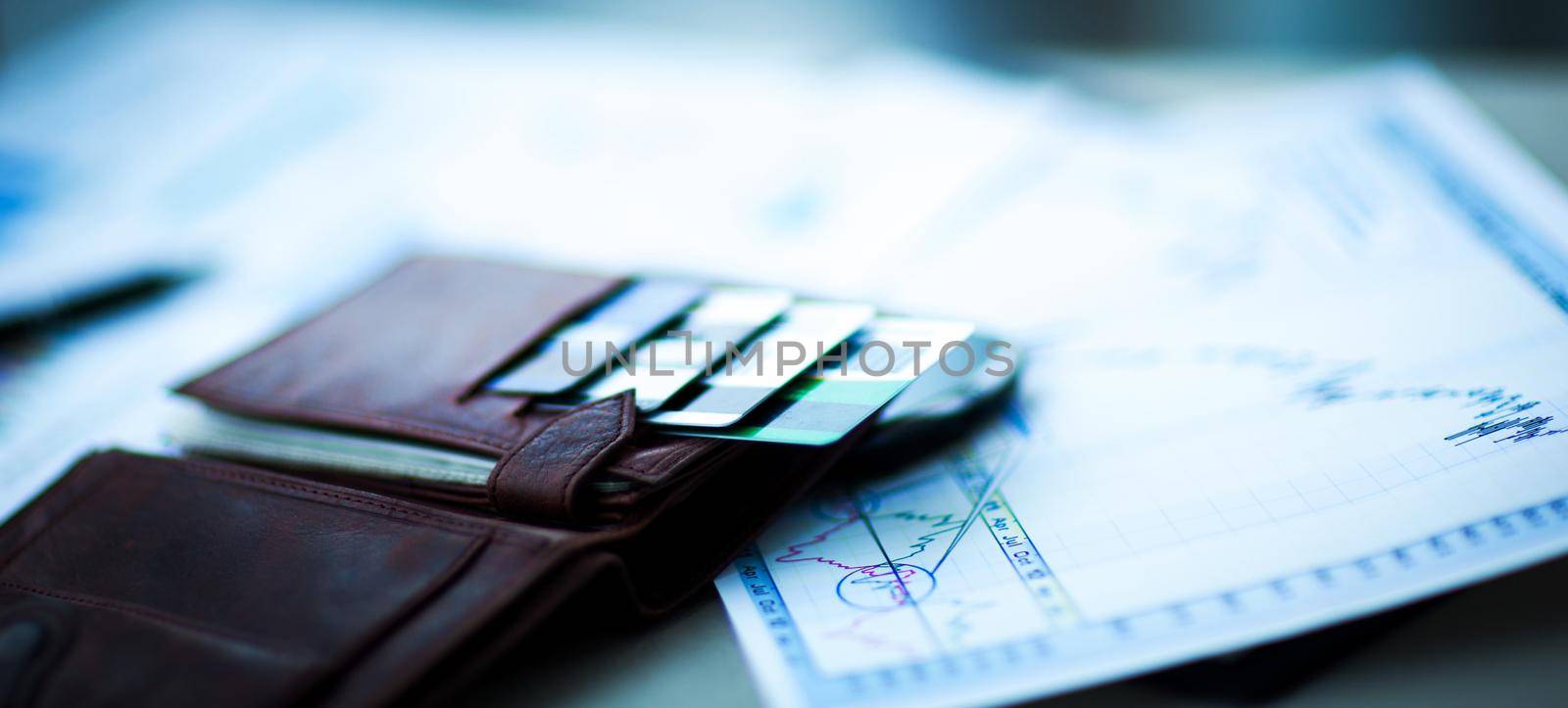 leather wallet with credit and discount cards in office