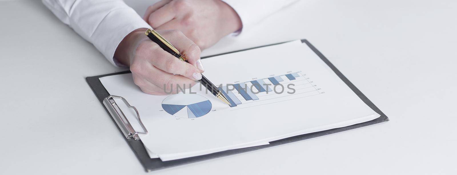 closeup.business woman checking marketing graphics.isolated on white.