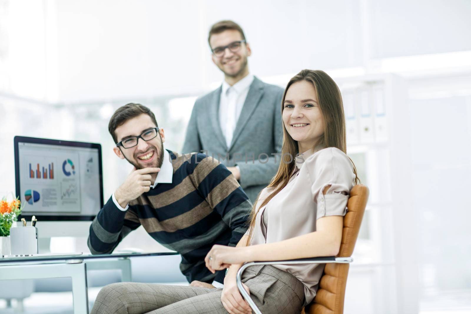 group of financial experts work with financial reports at the workplace in a modern office.the photo has a empty space for your text.