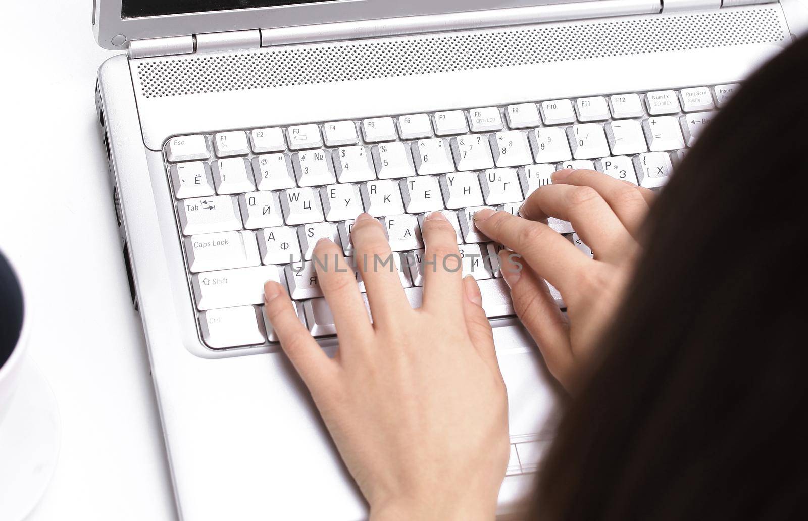 closeup.young woman typing text on laptop keyboard.people and technology