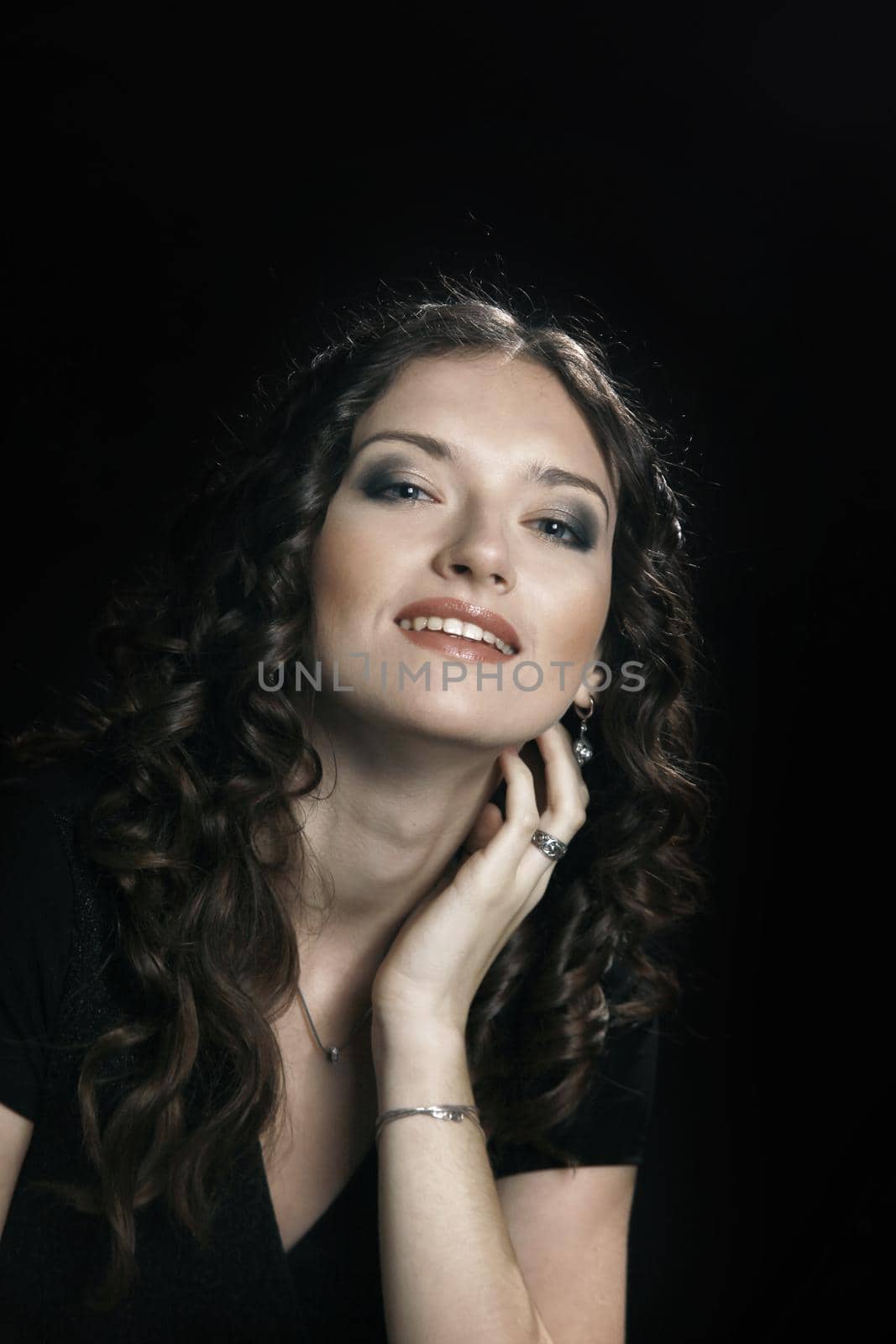 closeup. portrait of beautiful woman with evening make-up.isolated on black background