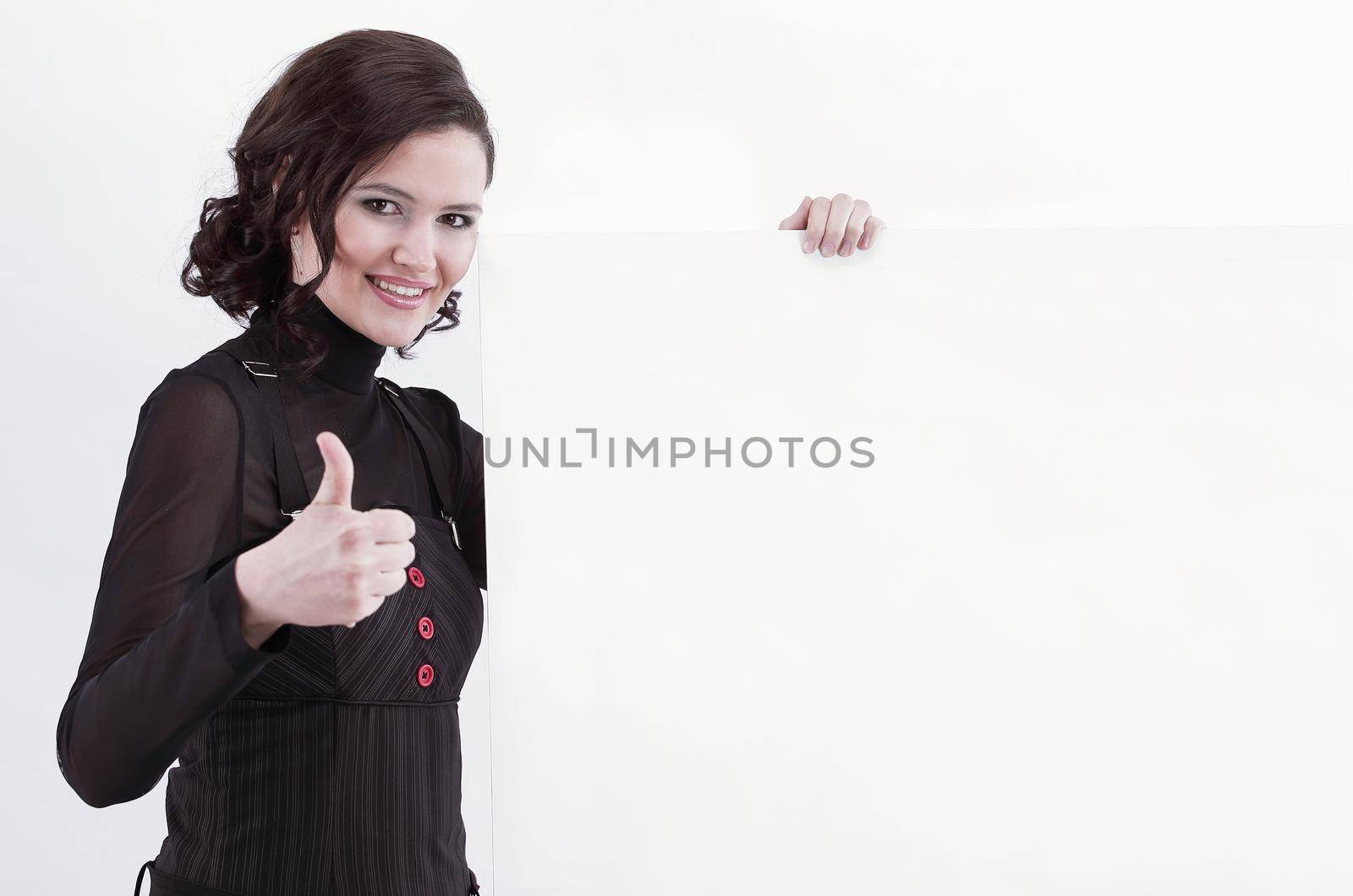 business woman holding a blank banner and showing thumb up.photo with copy space