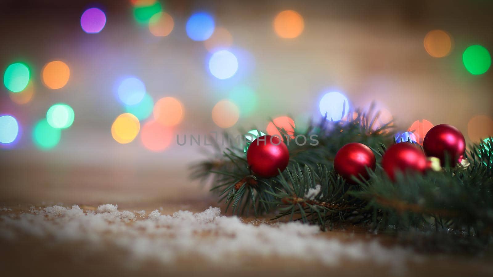 Christmas background.Christmas tree branch with balls on wooden by SmartPhotoLab