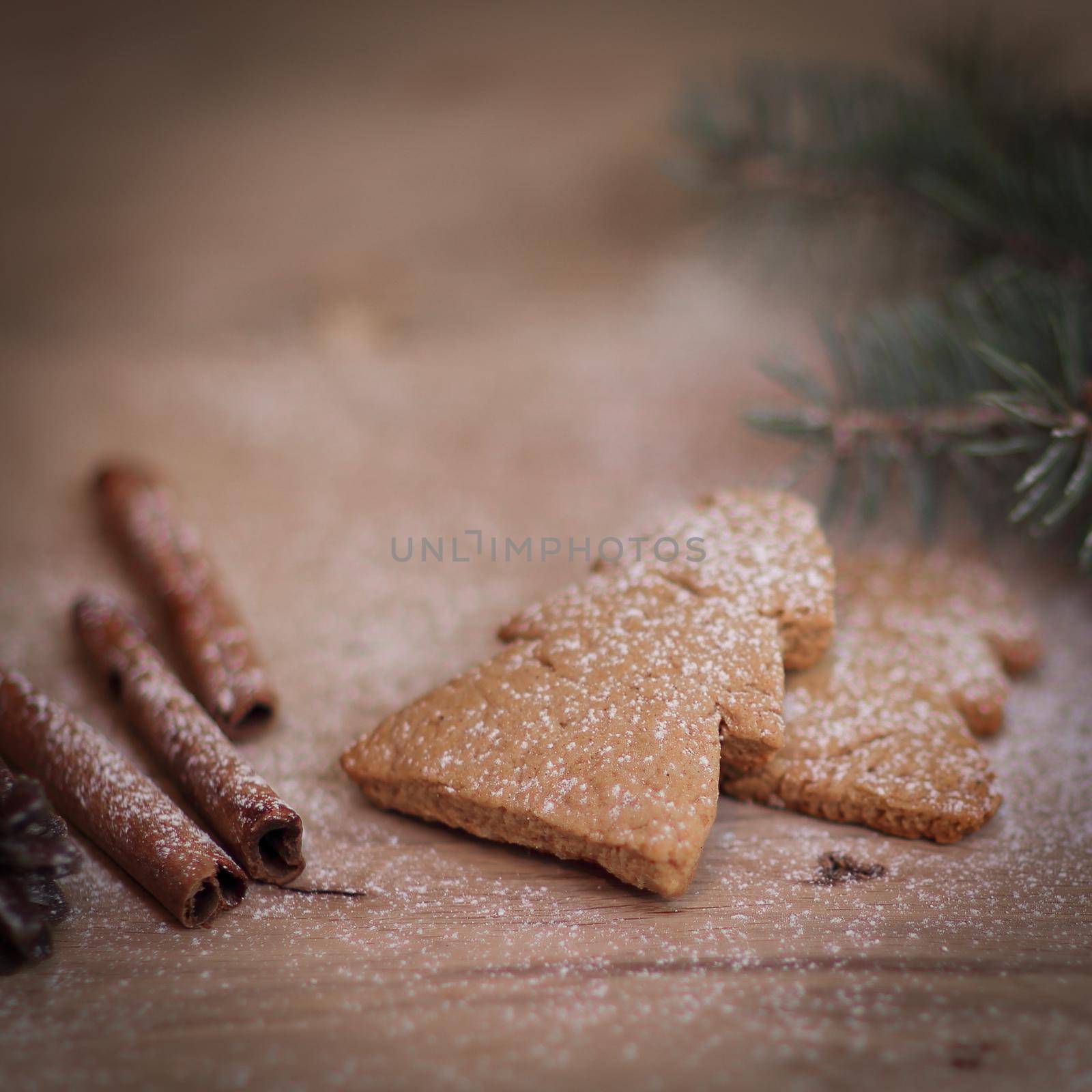 cinnamon sticks, cookies and Christmas tree branch but the table .Christmas background