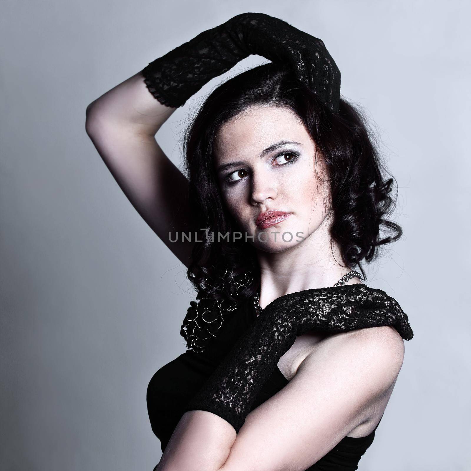 portrait of beautiful young woman in a black dress by SmartPhotoLab