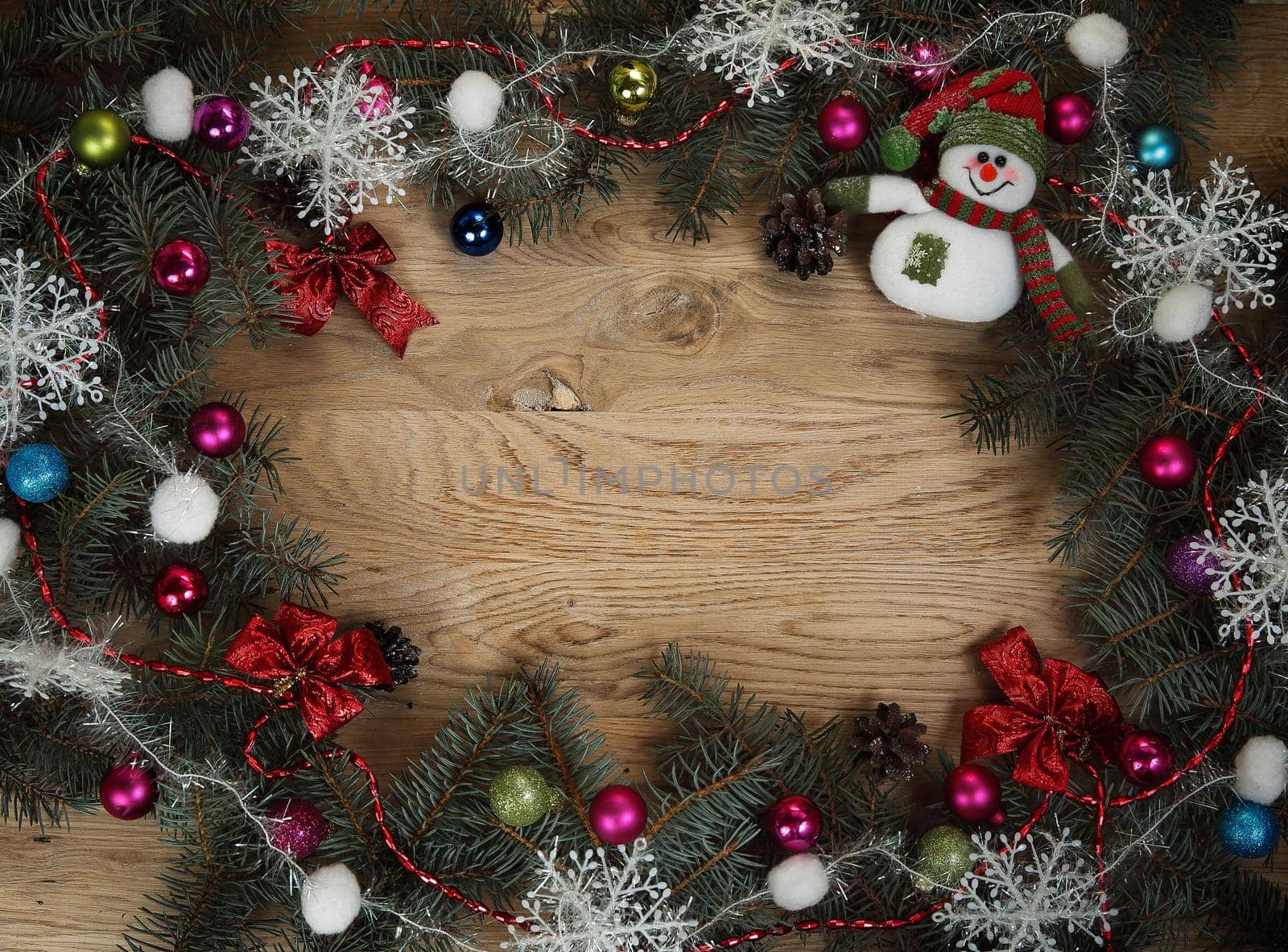 beautifully decorated Christmas wreath on wooden background by SmartPhotoLab