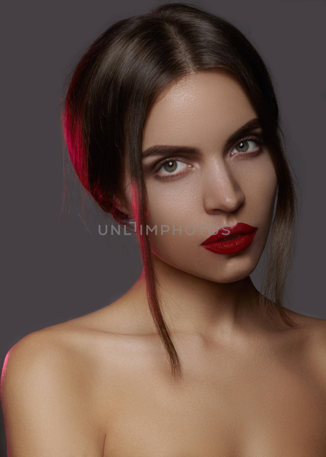 Beautiful model with fashion make-up. Close-up portrait sexy woman with glamour lip gloss makeup and bright eye shadows. by MarinaFrost