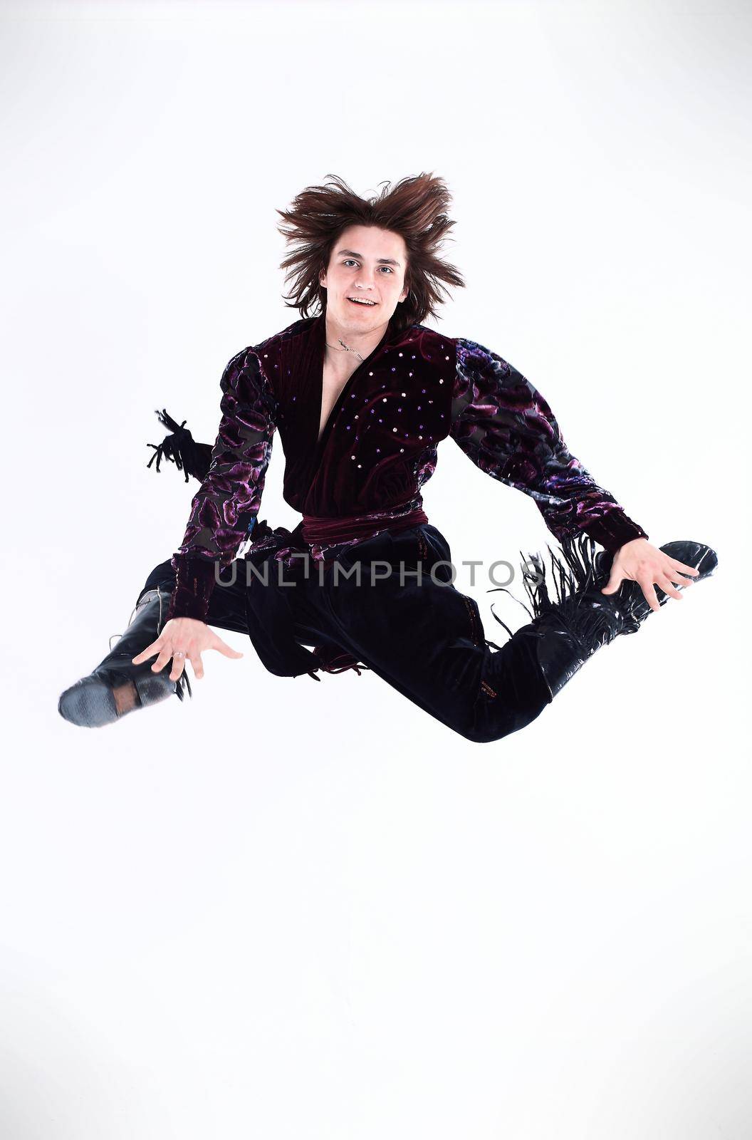 male dancer.Gypsy dance.jumping photo.a dance show.the national costume.ethnic culture.the photo with blank space for text