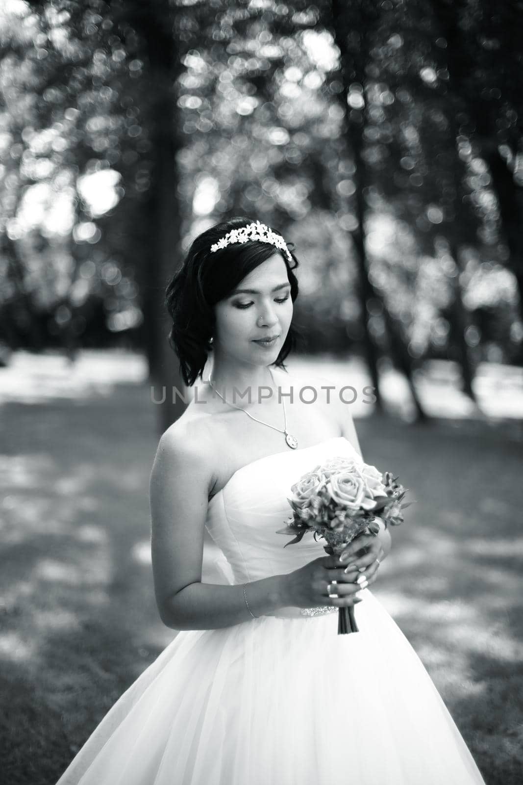 black-and-white photo.portrait of bride with bouquet.photo in retro style.