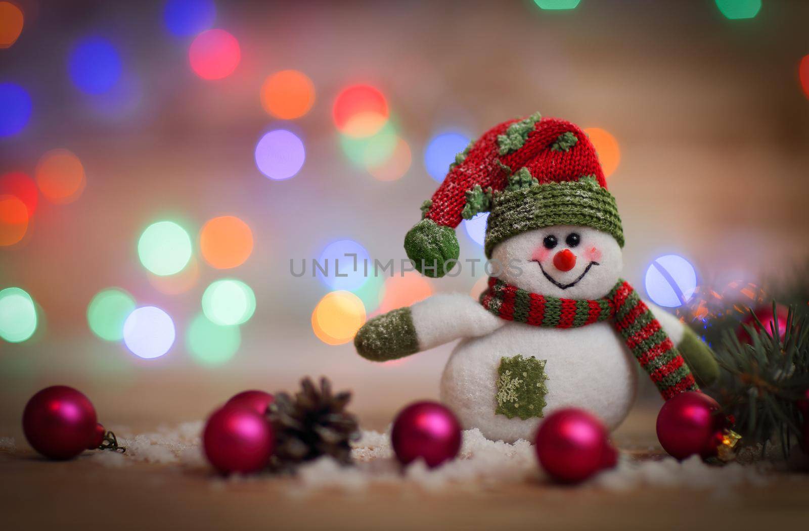 Christmas card. toy snowman on Christmas background.photo with place for text