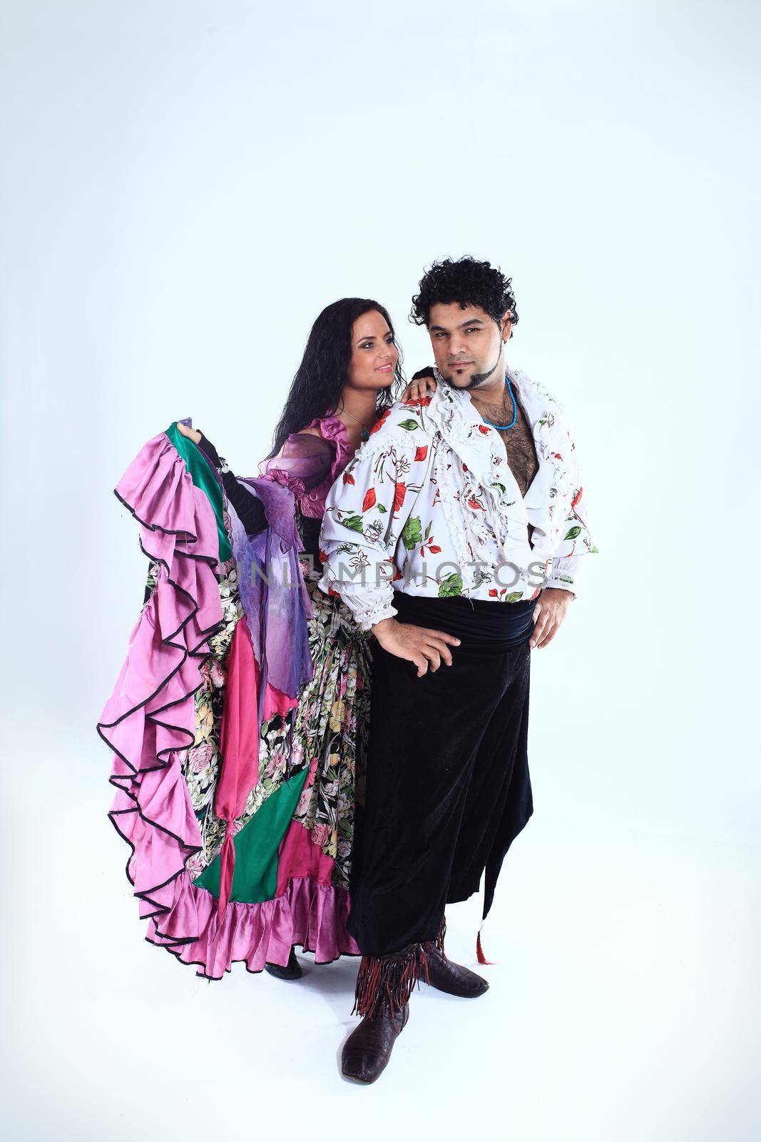 professional dance couple in a Gypsy costume perform folk dance by SmartPhotoLab