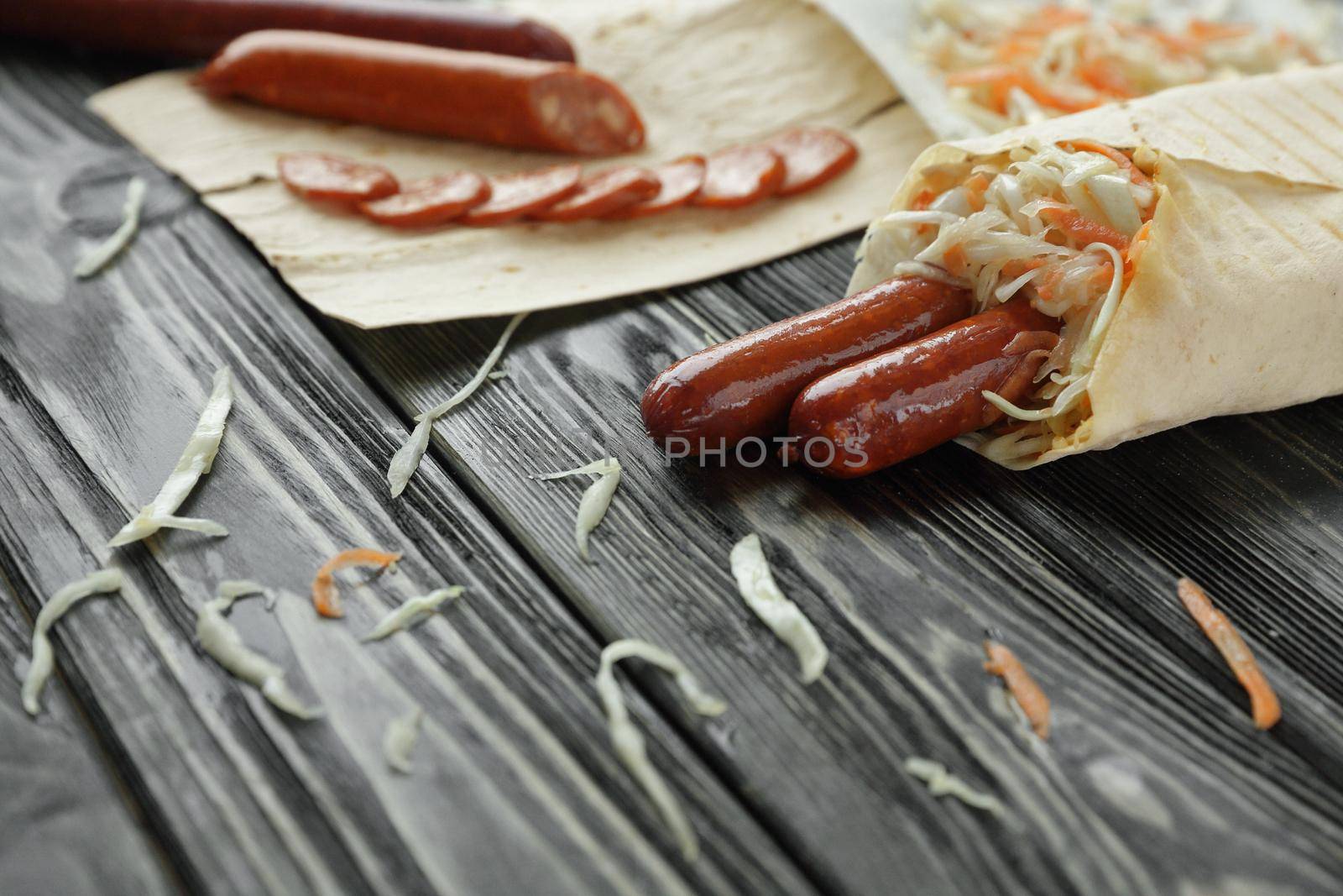 Shawarma and ingredients on a dark wood background .photo with c by SmartPhotoLab