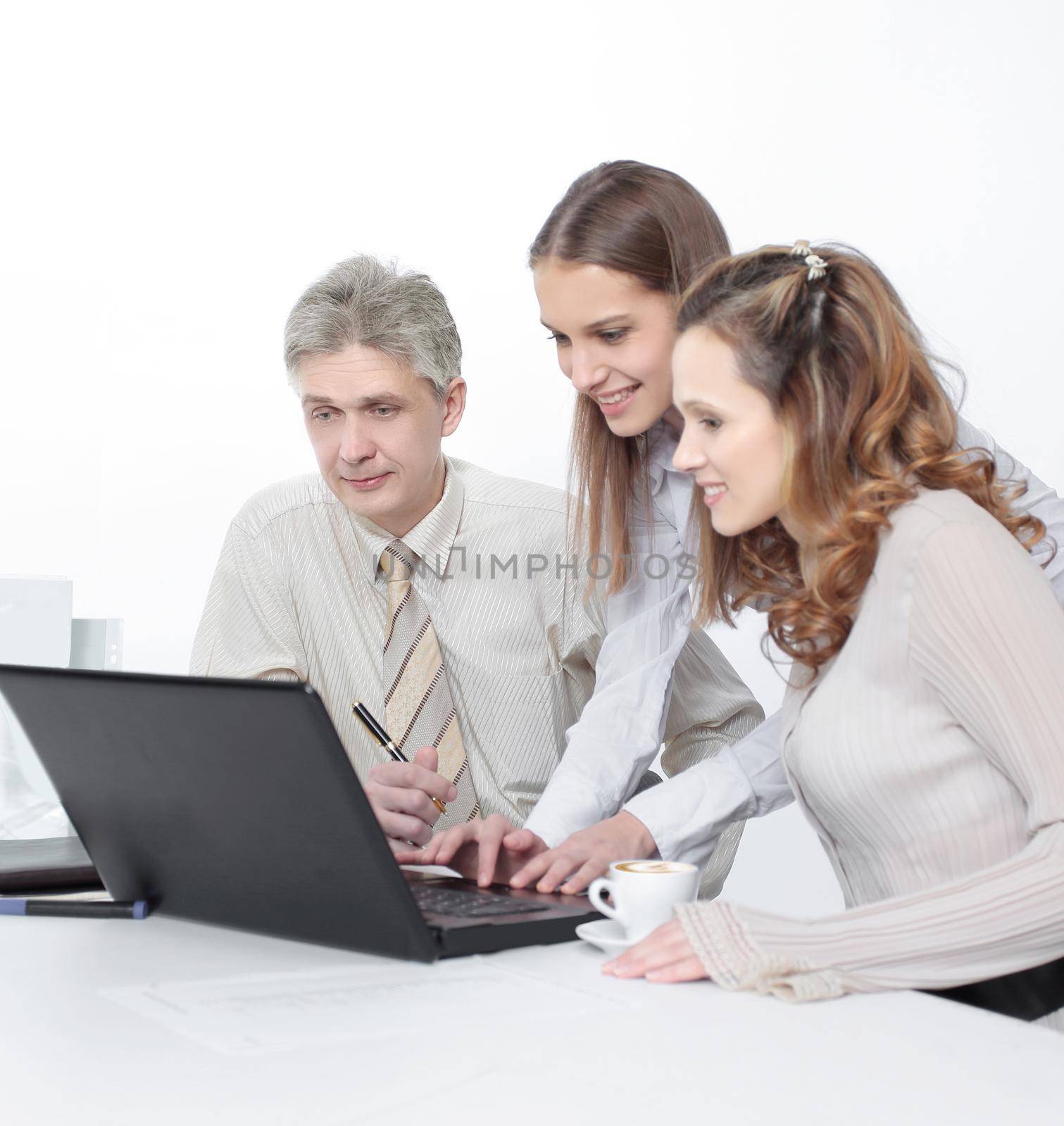 closeup.senior Manager and employees looking at laptop screen