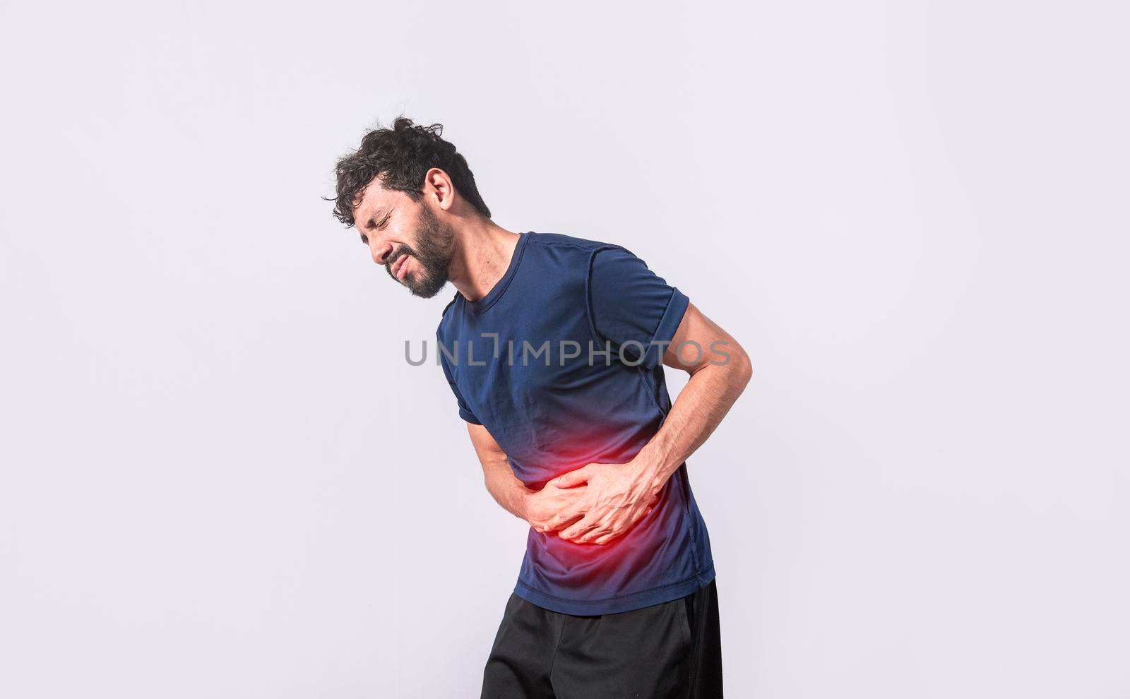 person with stomach pain, stomach problems concept, man with digestive problems, man with stomach pain, isolated by isaiphoto