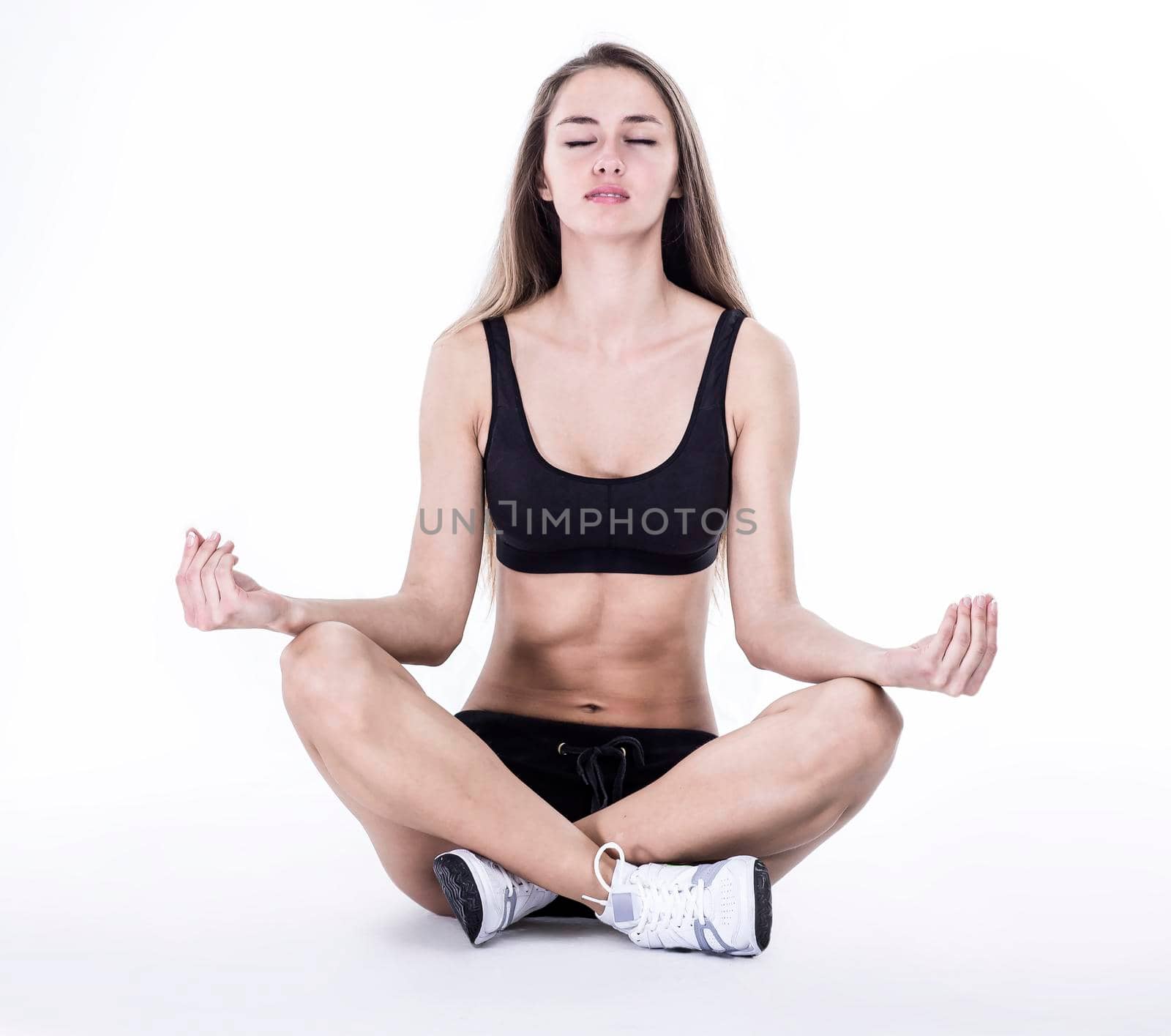 fitness instructor performs an exercise to strengthen the muscles by SmartPhotoLab