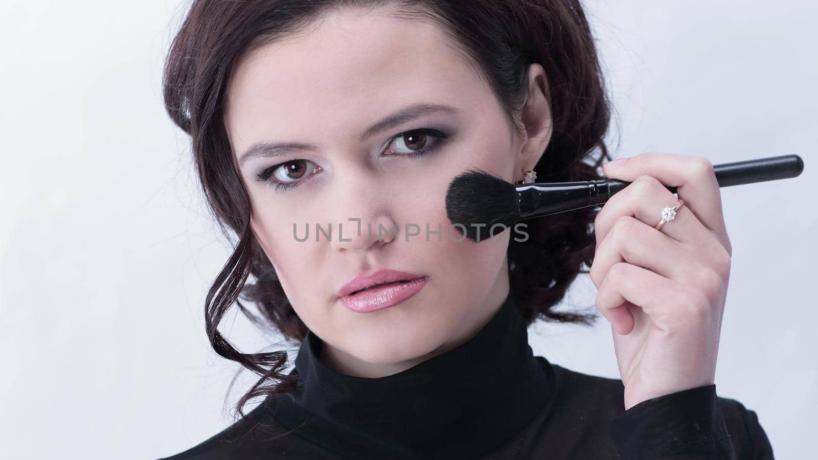stylish young woman with brush for makeup.photo with copy space