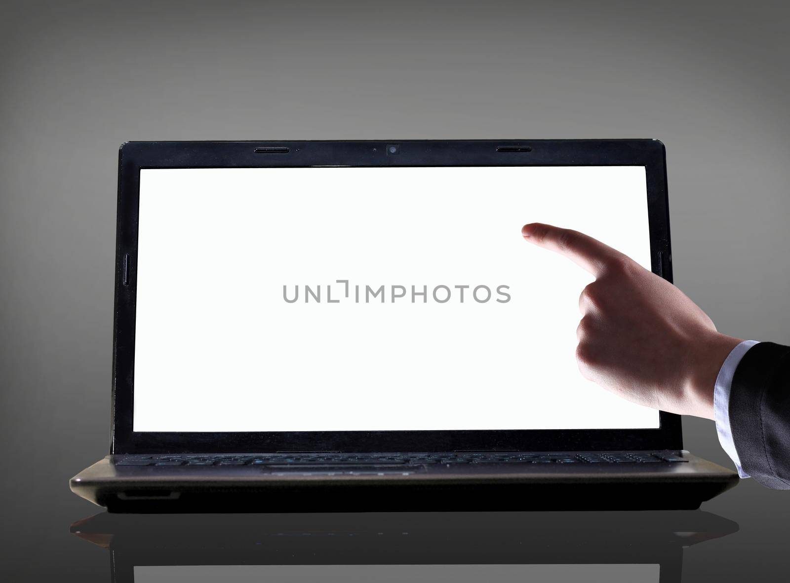 Close-up of male hand with forefinger pointing at laptop screen over black background by SmartPhotoLab